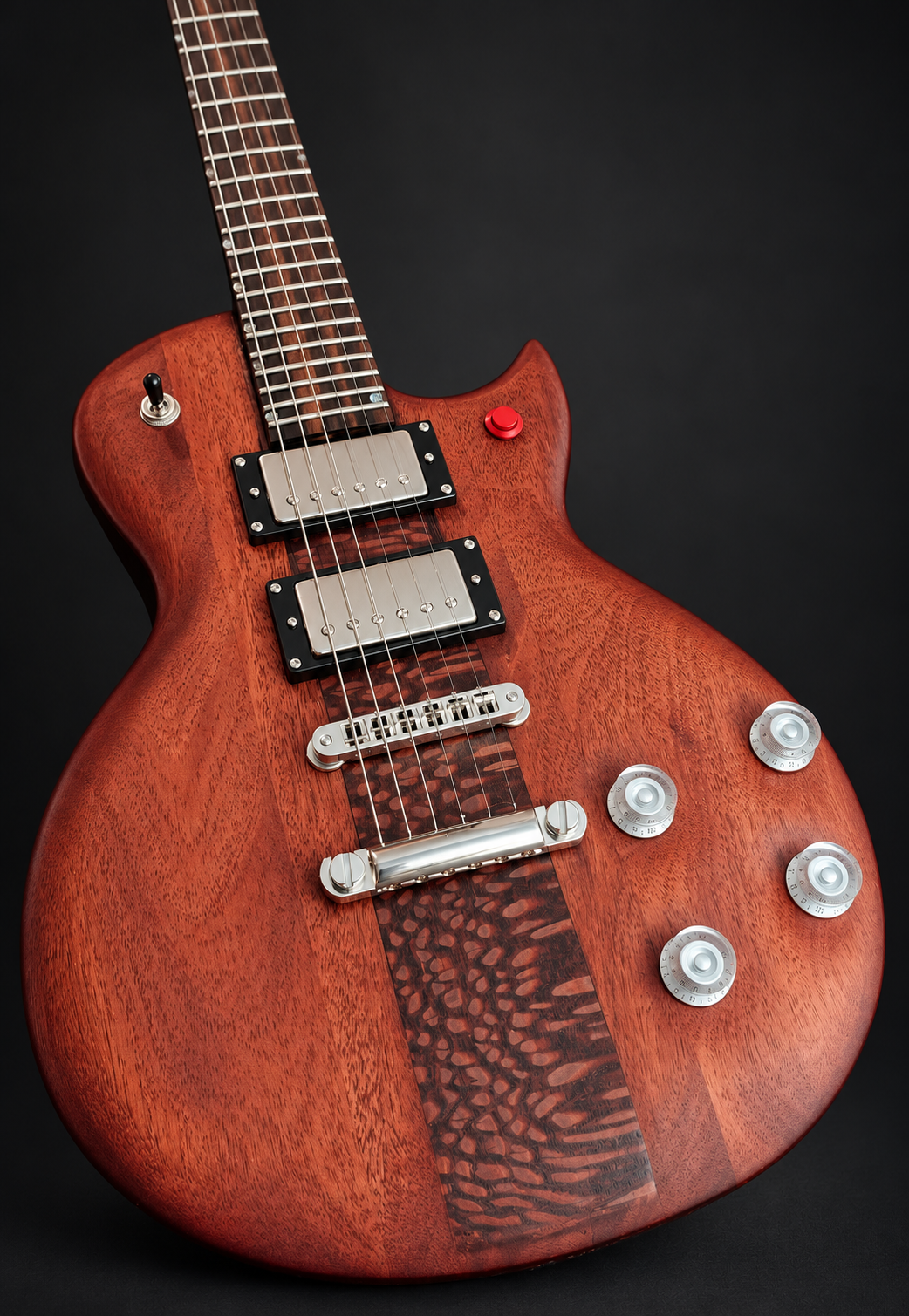 Red guitar body with figured center stripe and silver controls